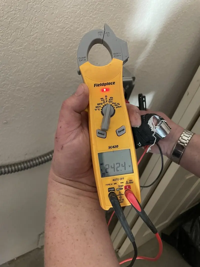 Voltage testing with clamp meter during Recessed Lighting Installation in Emmett